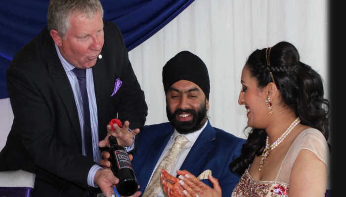 Kevin Bird performing wedding magic for a delighted bride and groom